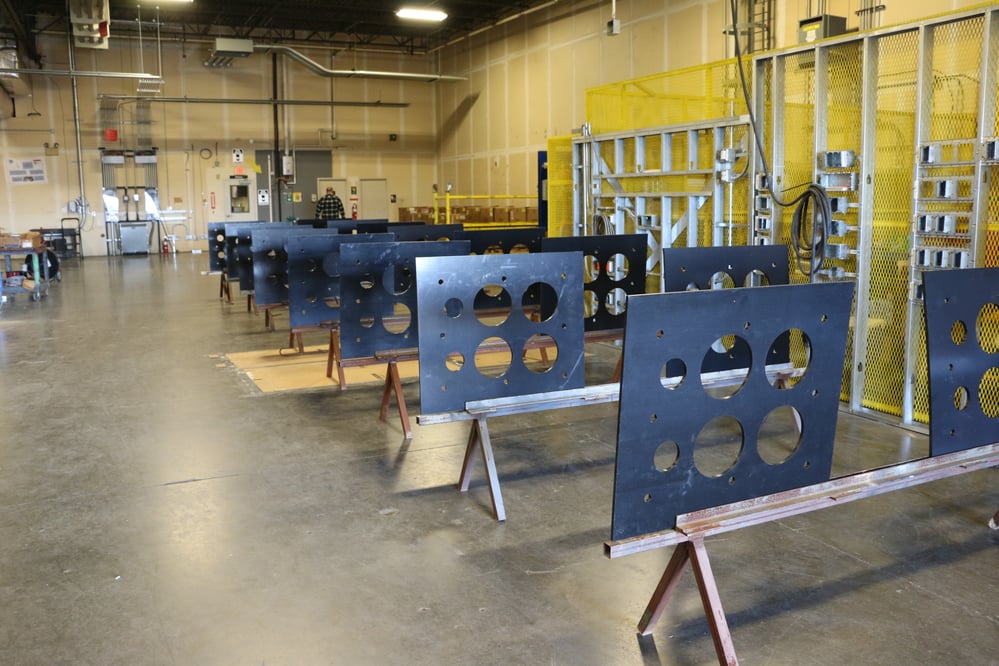rows of Prefabricated metal sheets with cutouts