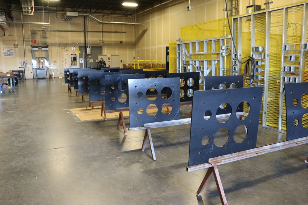 rows of Prefabricated metal sheets with cutouts