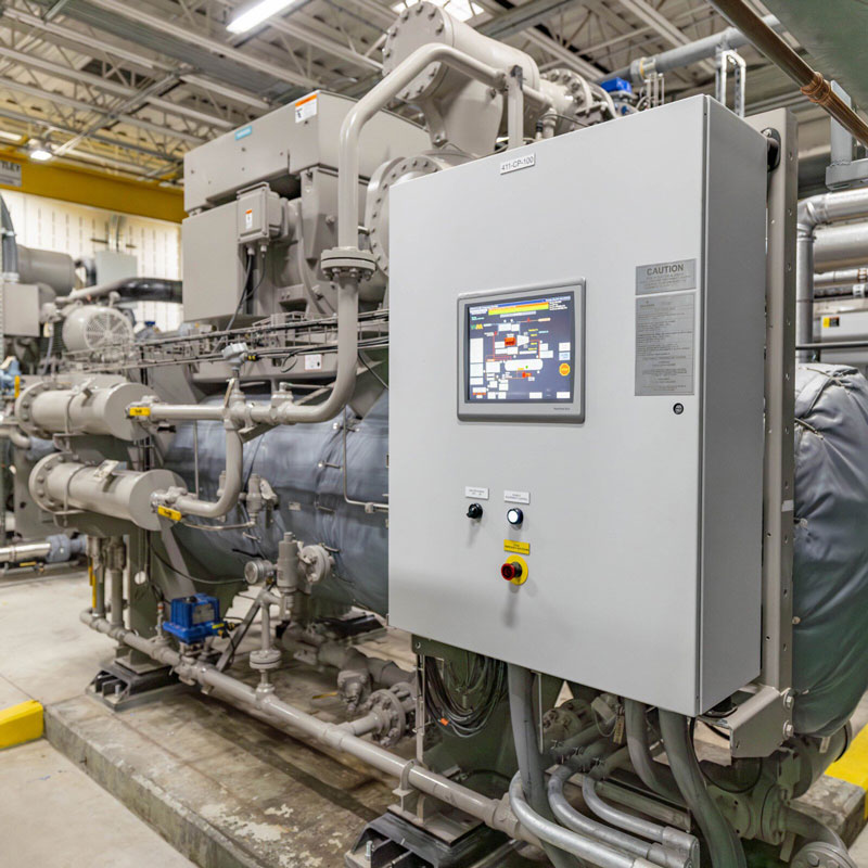 A large industrial machine installed in a factory setting, showcasing its complex design and engineering