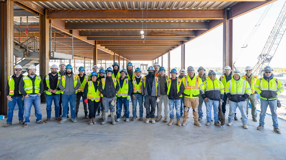 A group of engineers and electricians at a construction site