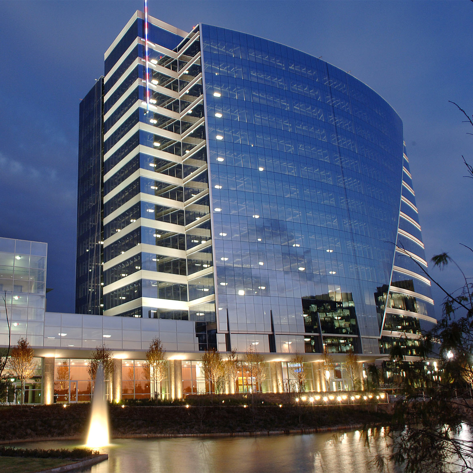 exterior of new building lit up at night