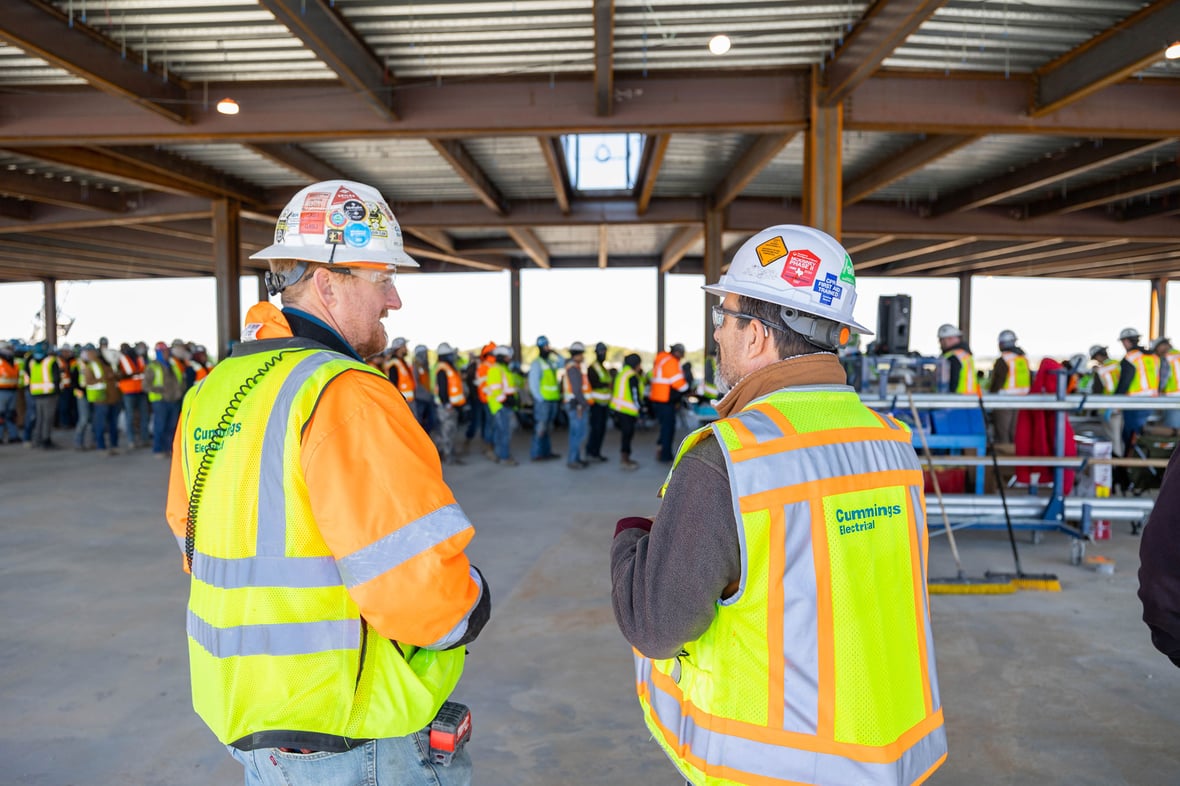 close up image of two Cummings employees at a company event