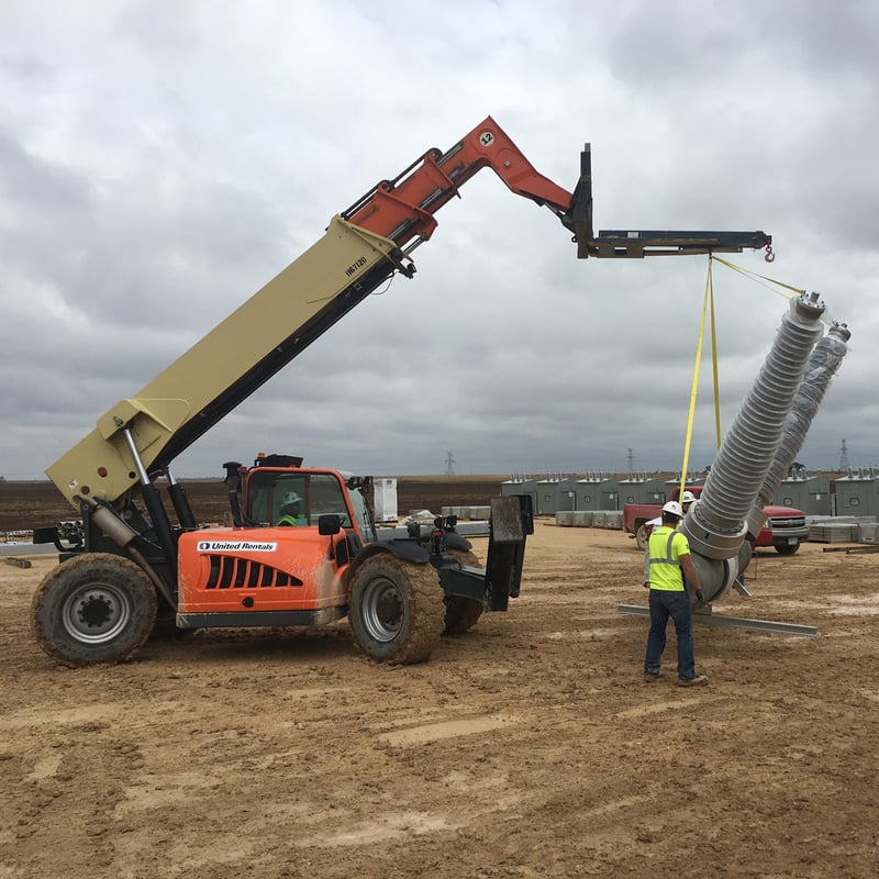 lifting large electrical equipment at construction site