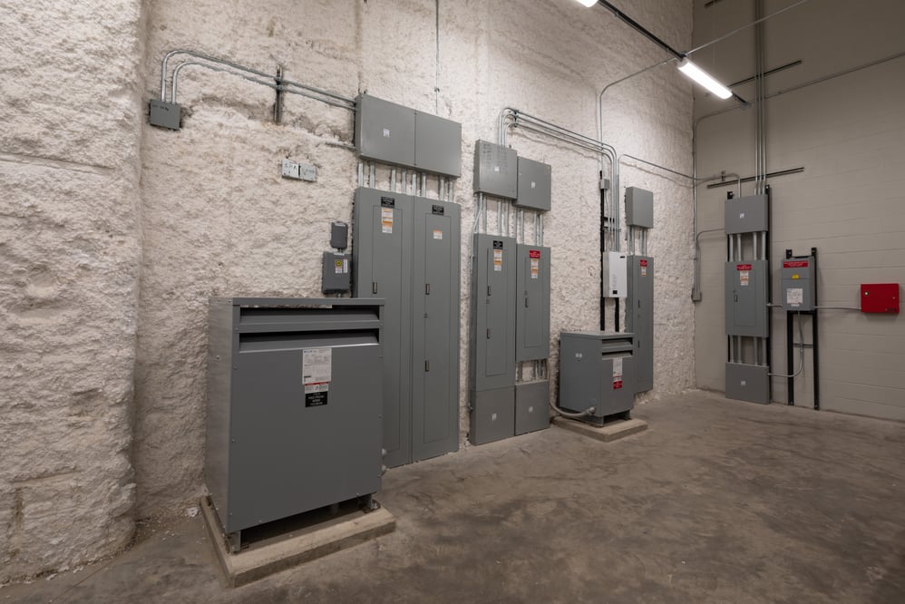room with various electrical panels and equipment