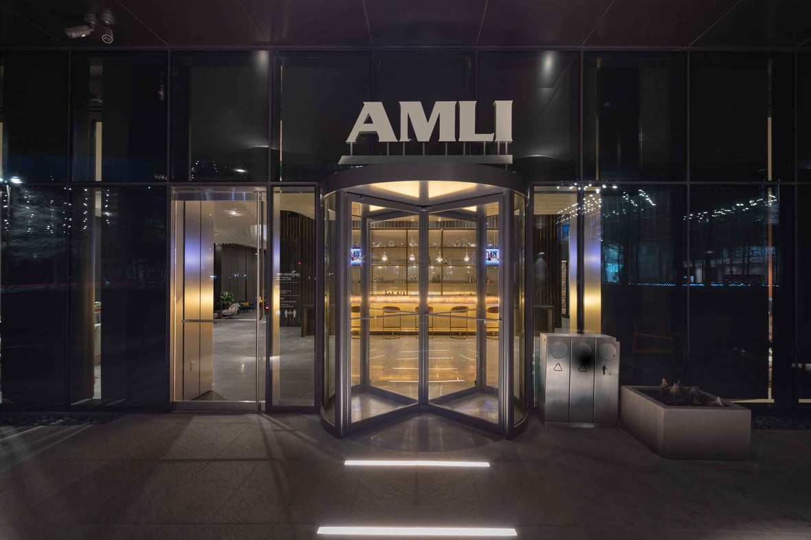 Dark nighttime view of a building front entrance with 
