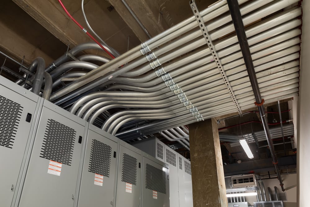 ceiling view of lines of conduit