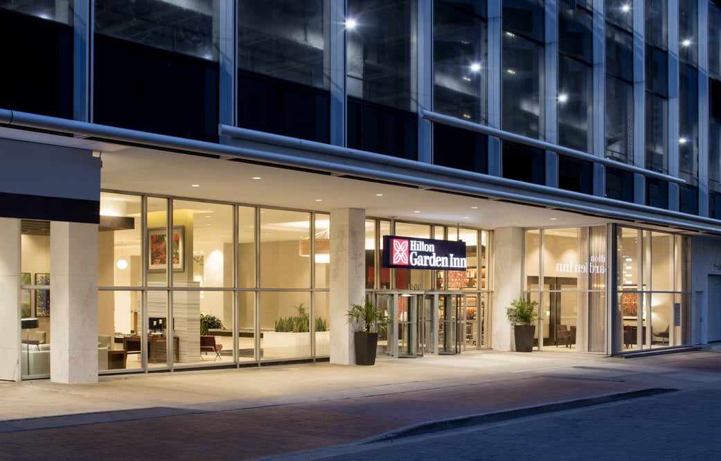 Outdoor view of the entrance to a Hilton Garden Inn