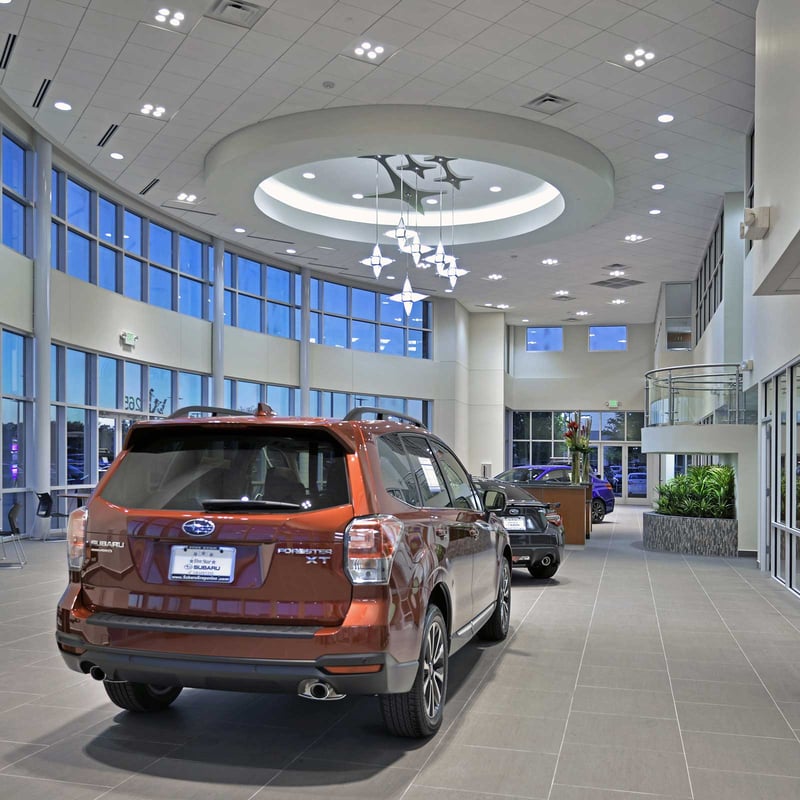 Interior of a modern Subaru dealership showroom