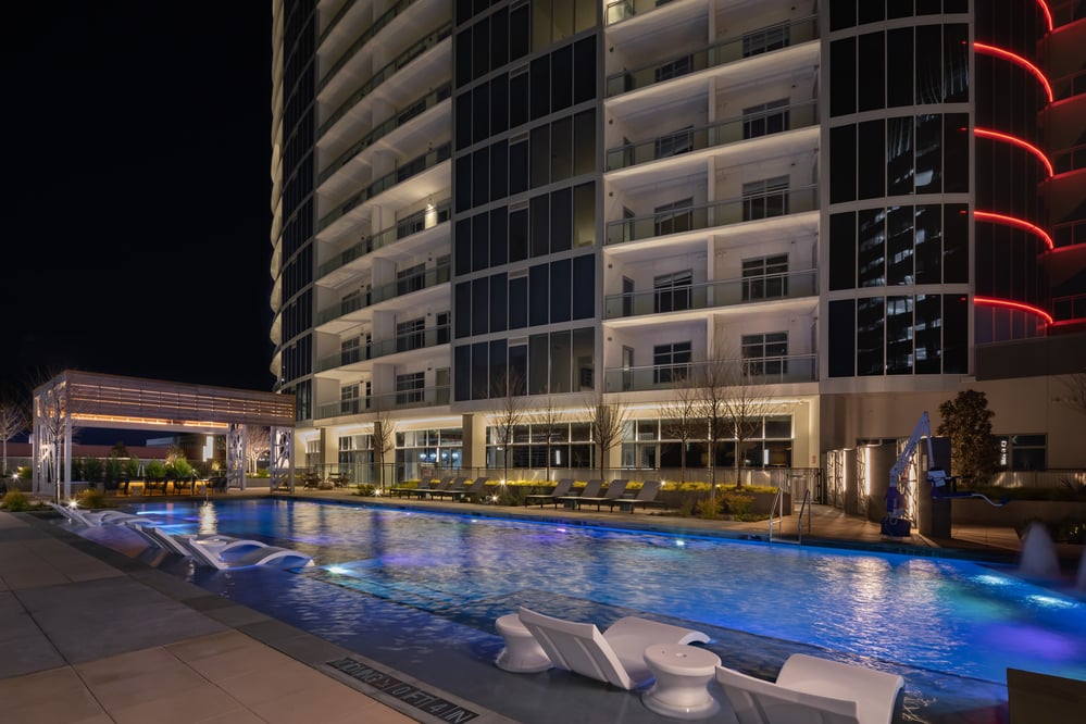 outdoor view of a modern hotel building next to a pool
