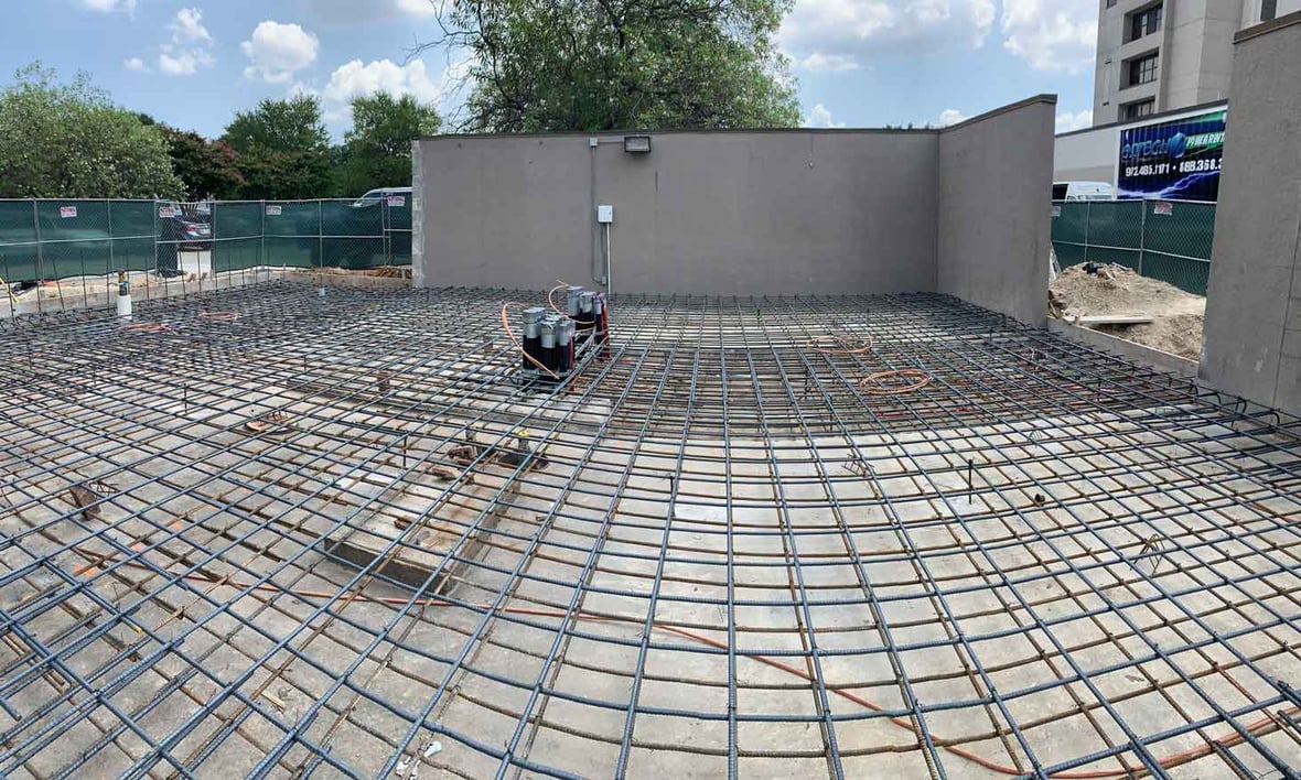 Concrete slab preparation with rebar grid for electrical generator installation