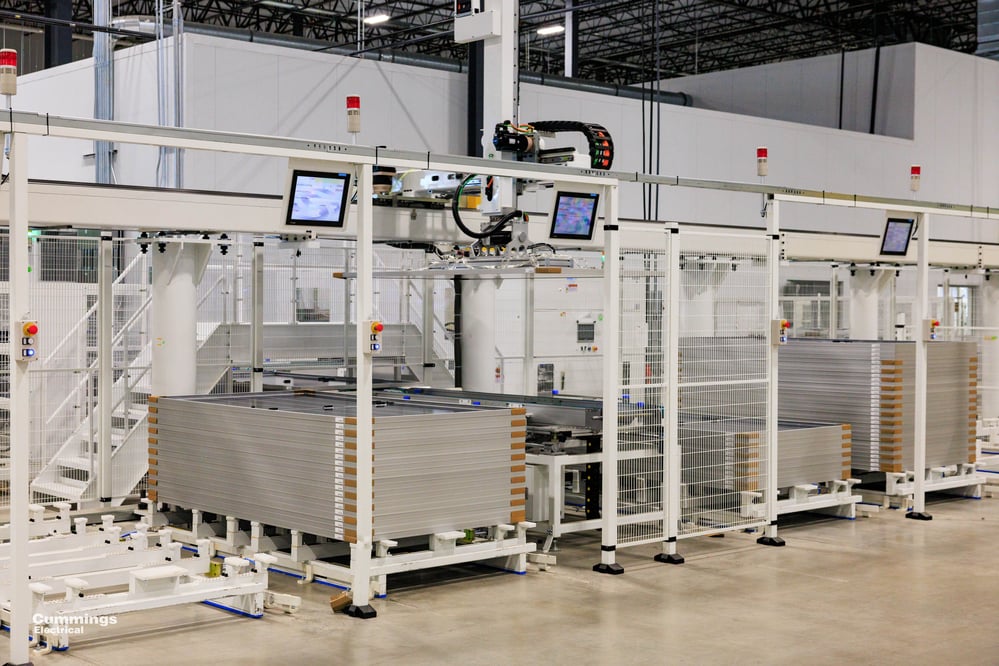 rows of high-tech screens and cages for manufacturing equipment