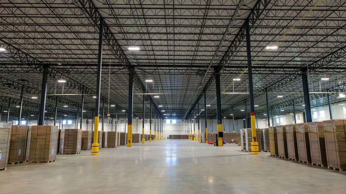 open view of a warehouse with boxes surrounding the floor