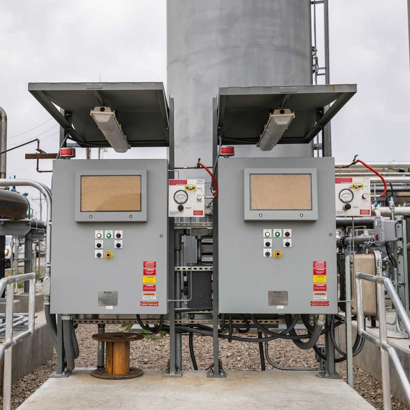 Two control panels outside of an industrial facility
