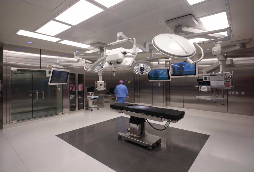 Surgical room with metal walls and various lighting sources
