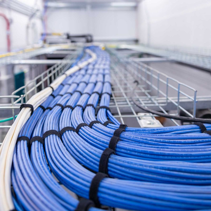 networking cables neatly organized above equipment